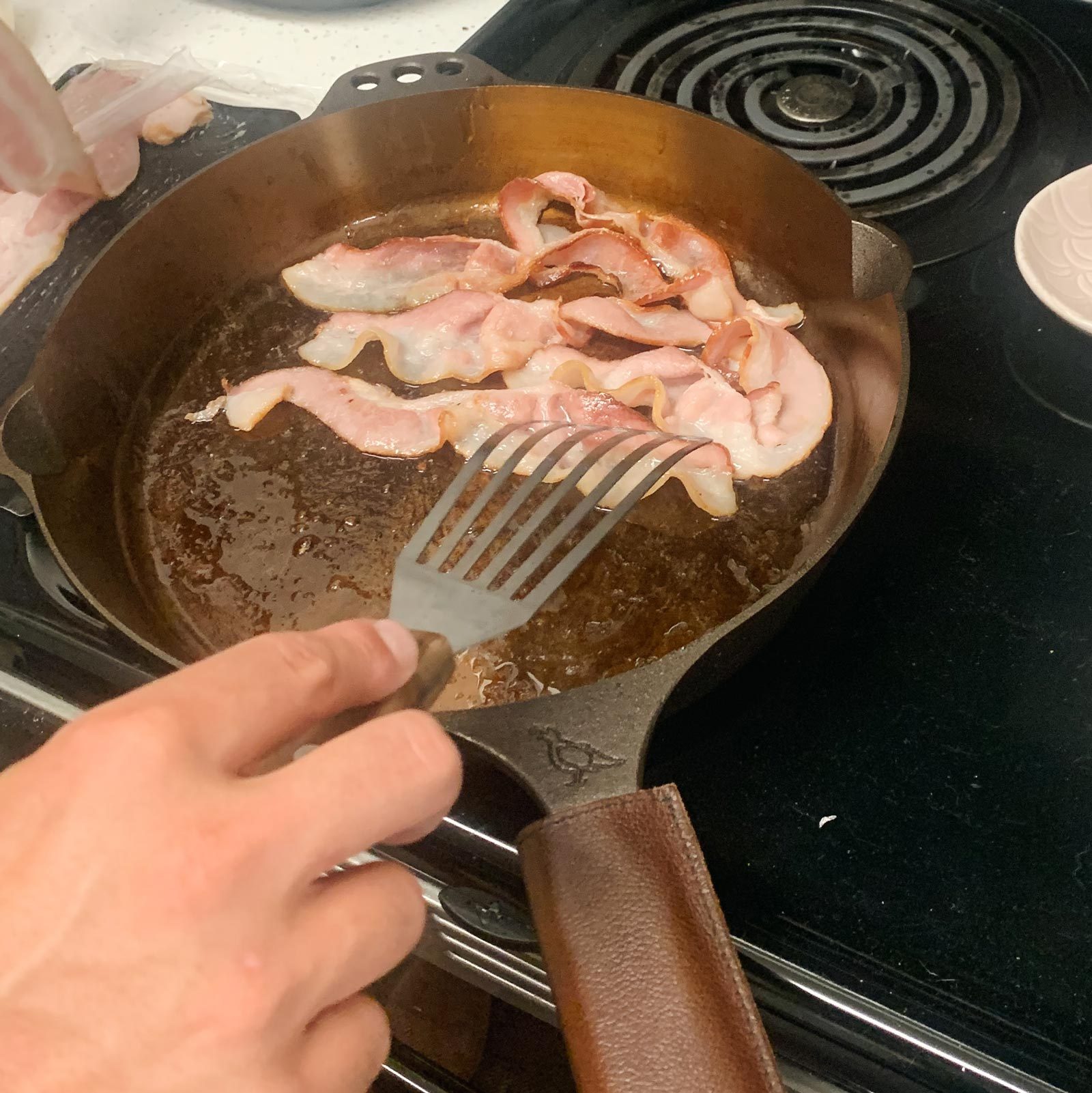 Cooking bacon in a Smithey Cast Iron Skillet
