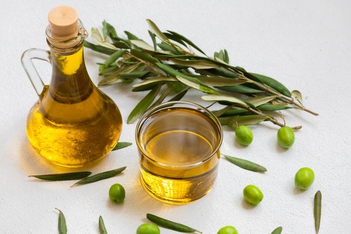 Image of raw olives and olive oil