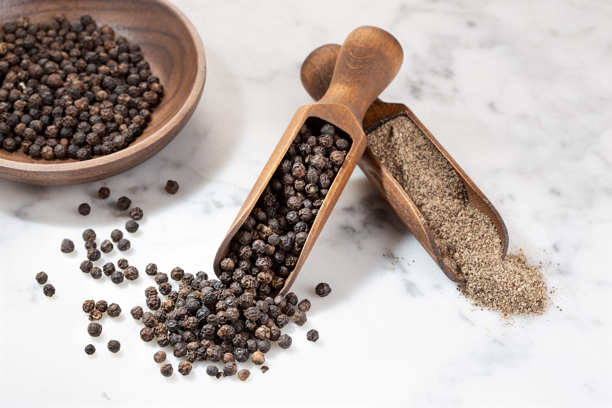 Black pepper seeds and Black pepper ground. Piper nigrum