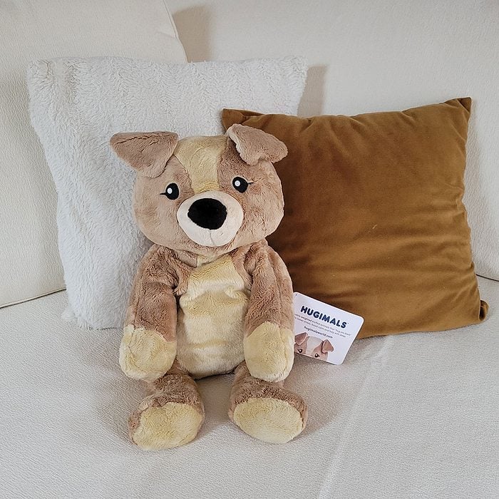 Hugimals on bed with cushions