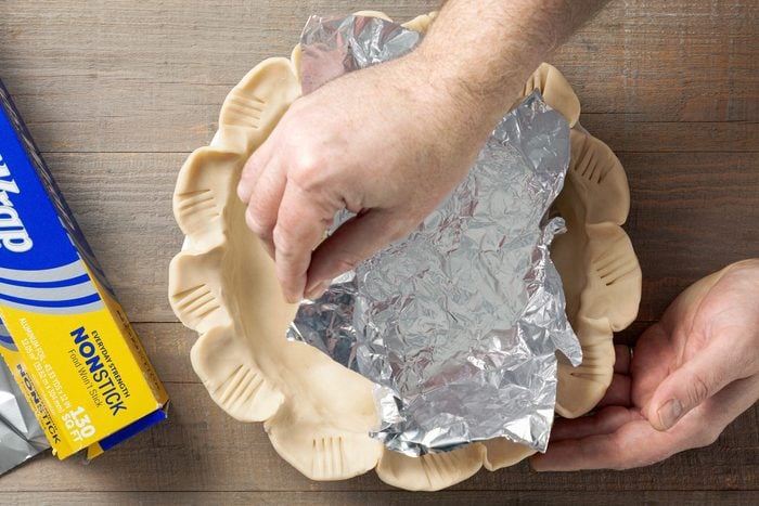 Pastry shell covered in foil paper