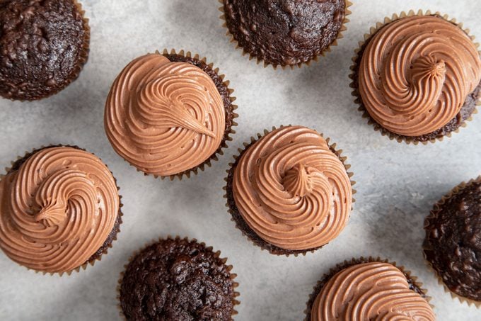 overhead view of frosted and unfrosted cupcakes