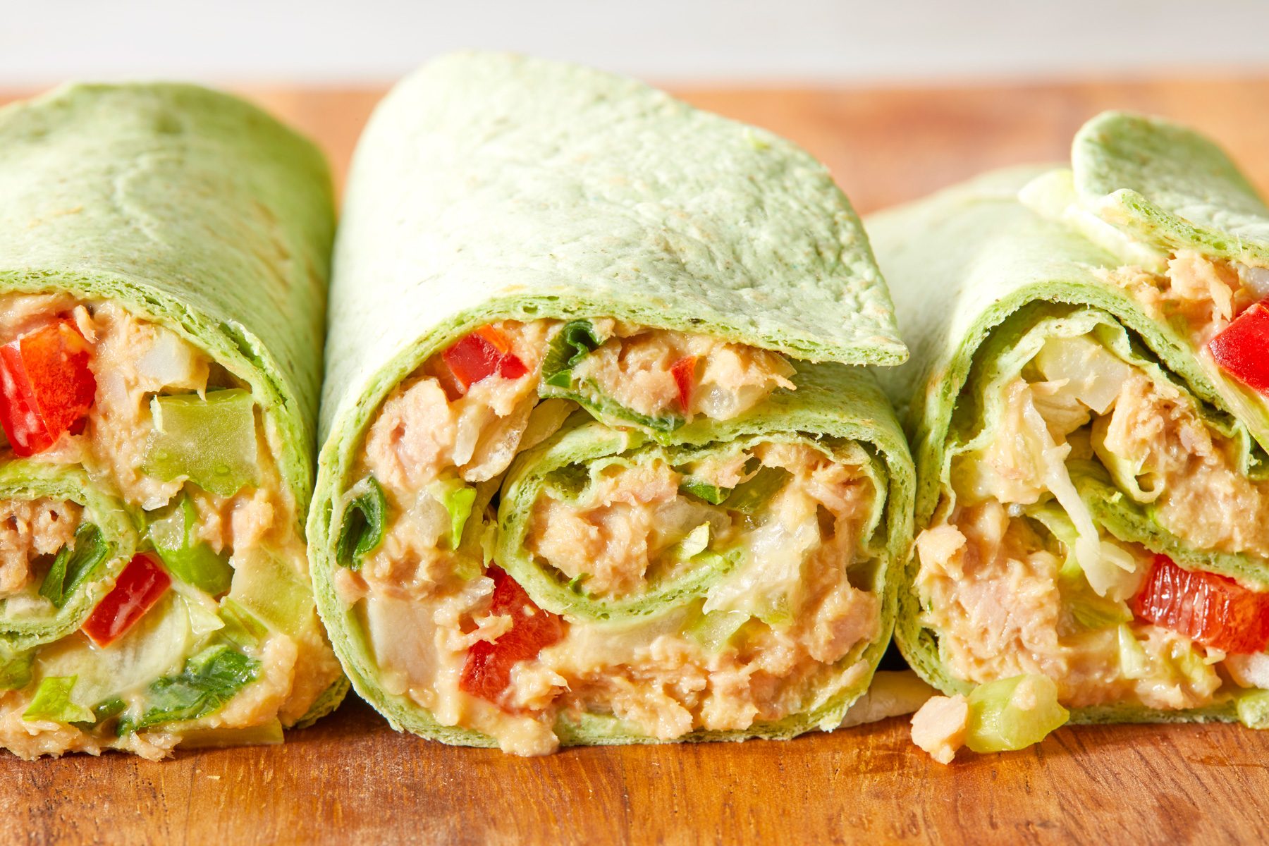 A group of Crunchy Tuna Wraps on a cutting board