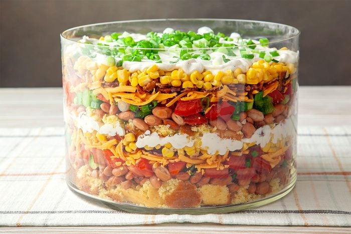 close shot of southern cornbread salad topped with green onions