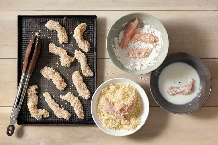 Dredge both sides of chicken through the flour