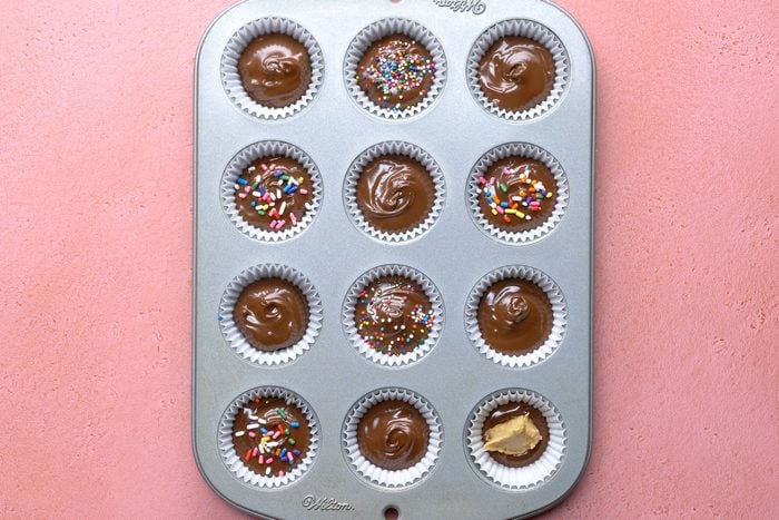 Drop the chocolate mixture into paper-lined mini muffin cups and decorate with sprinkles