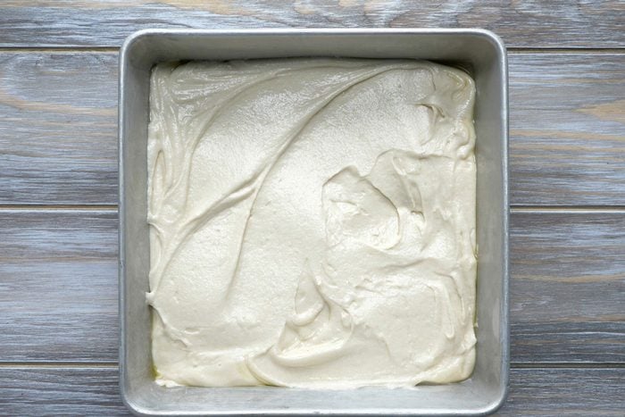 Pour the batter into the pan and spread it evenly to all four corners