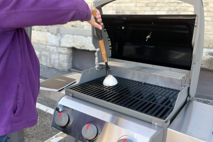 Rubbing Onion on Griller