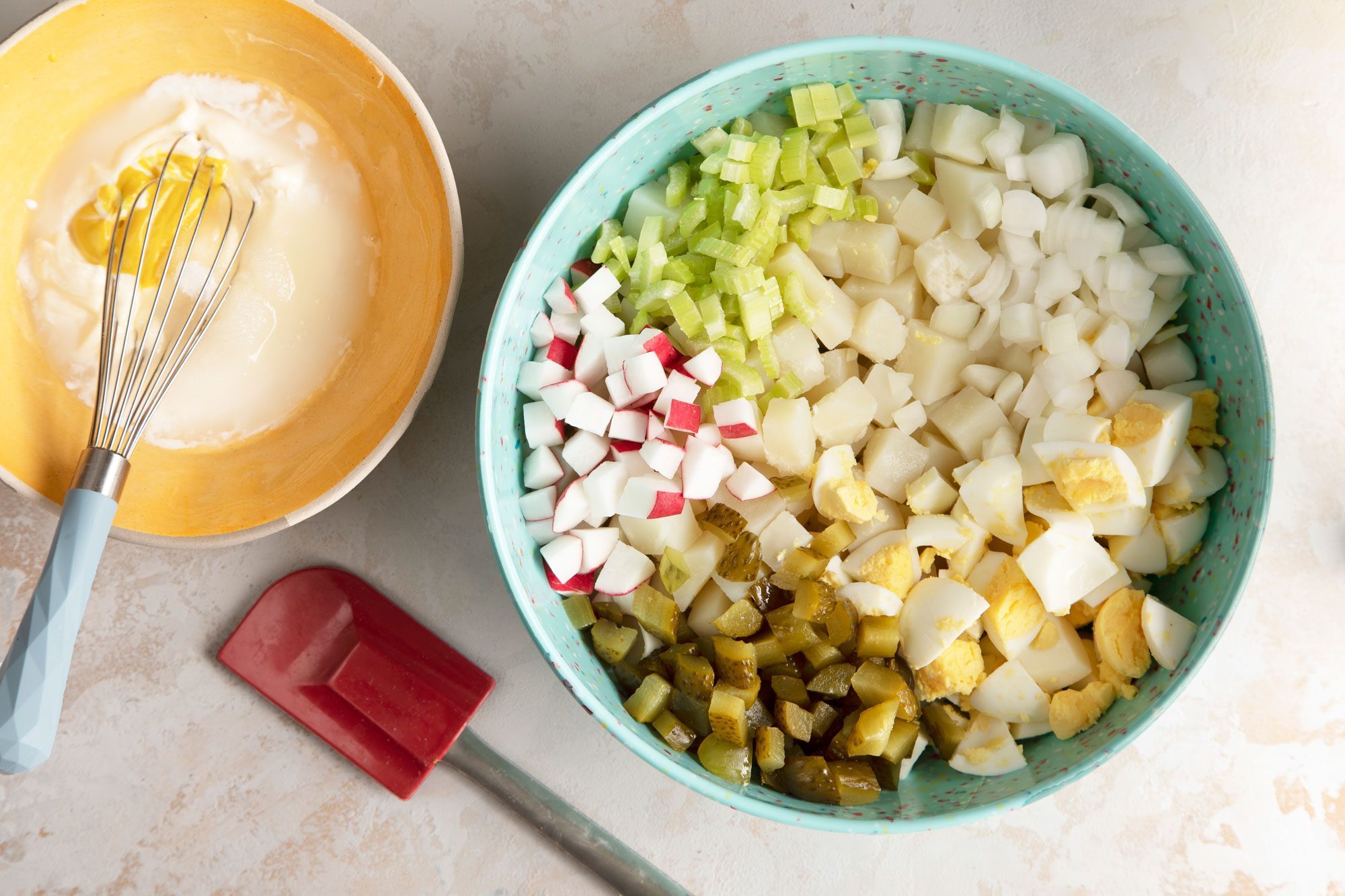 Place the potatoes in large bowl and add the eggs, celery, pickles, onion and radishes