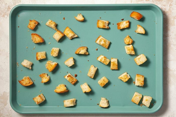 Overheda shot of baking pan; bake until golden brown; cream marble background