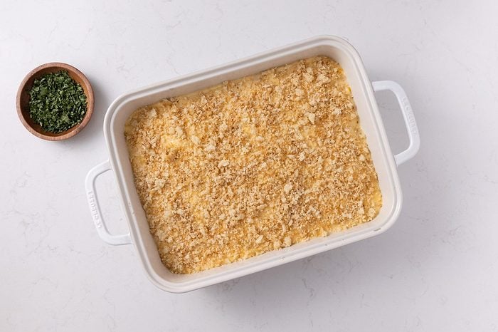 Casserole in baking dish assembled and ready to be baked.