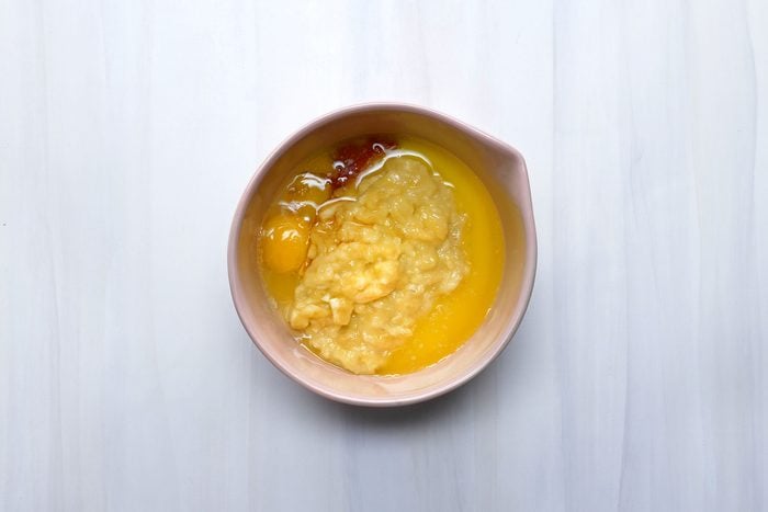 In another bowl, whisk egg, bananas, melted butter and vanilla until blended