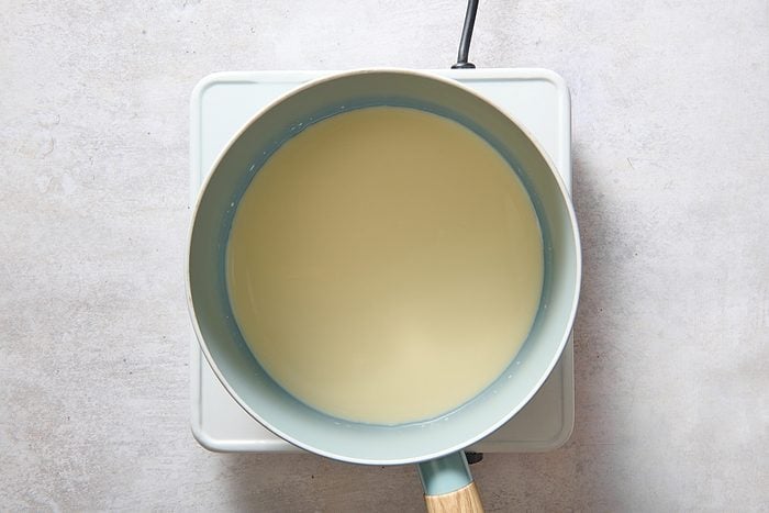 Warming the eggnog in a saucepan