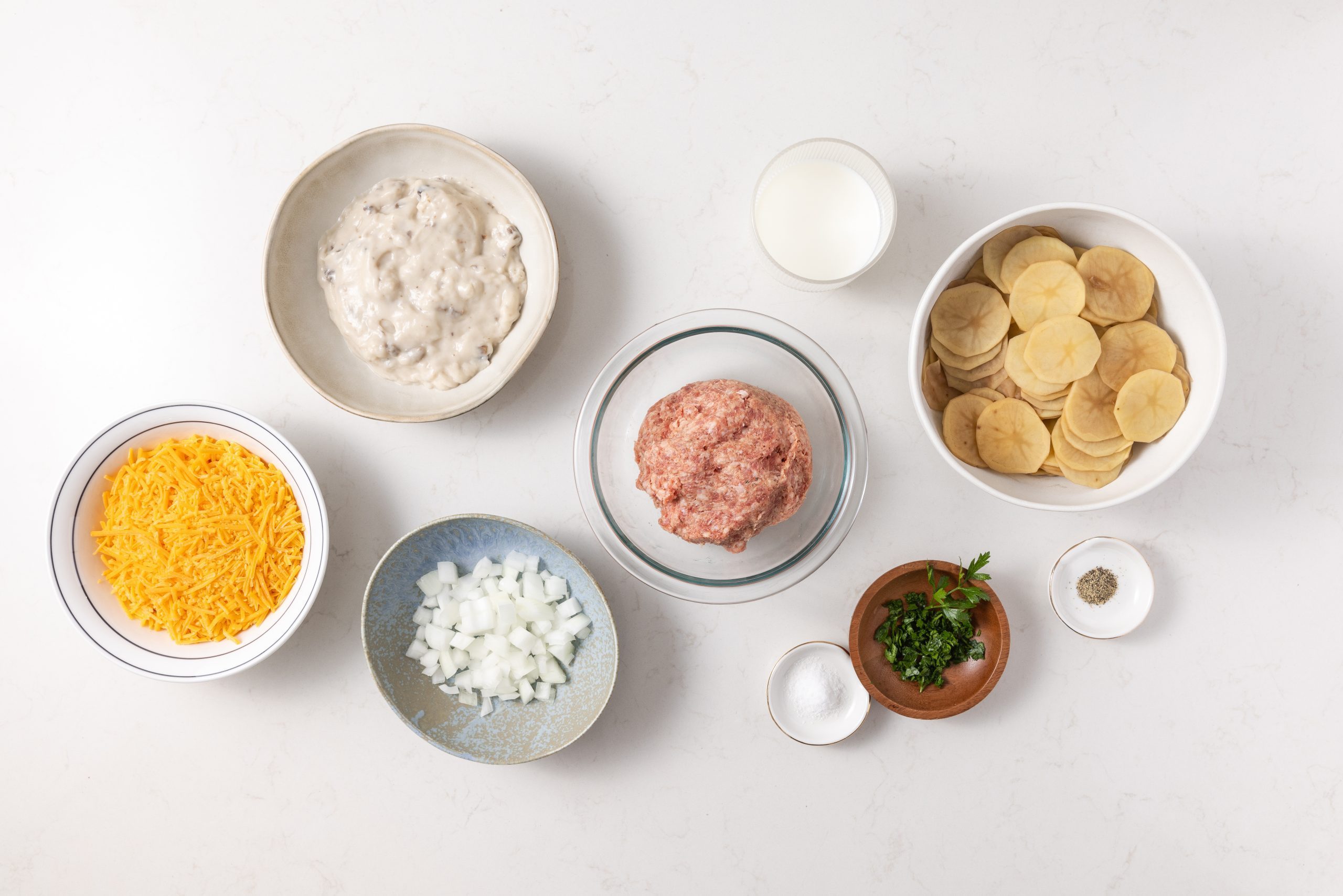 Ingredients for potato sausage casserole on kitchen counter.