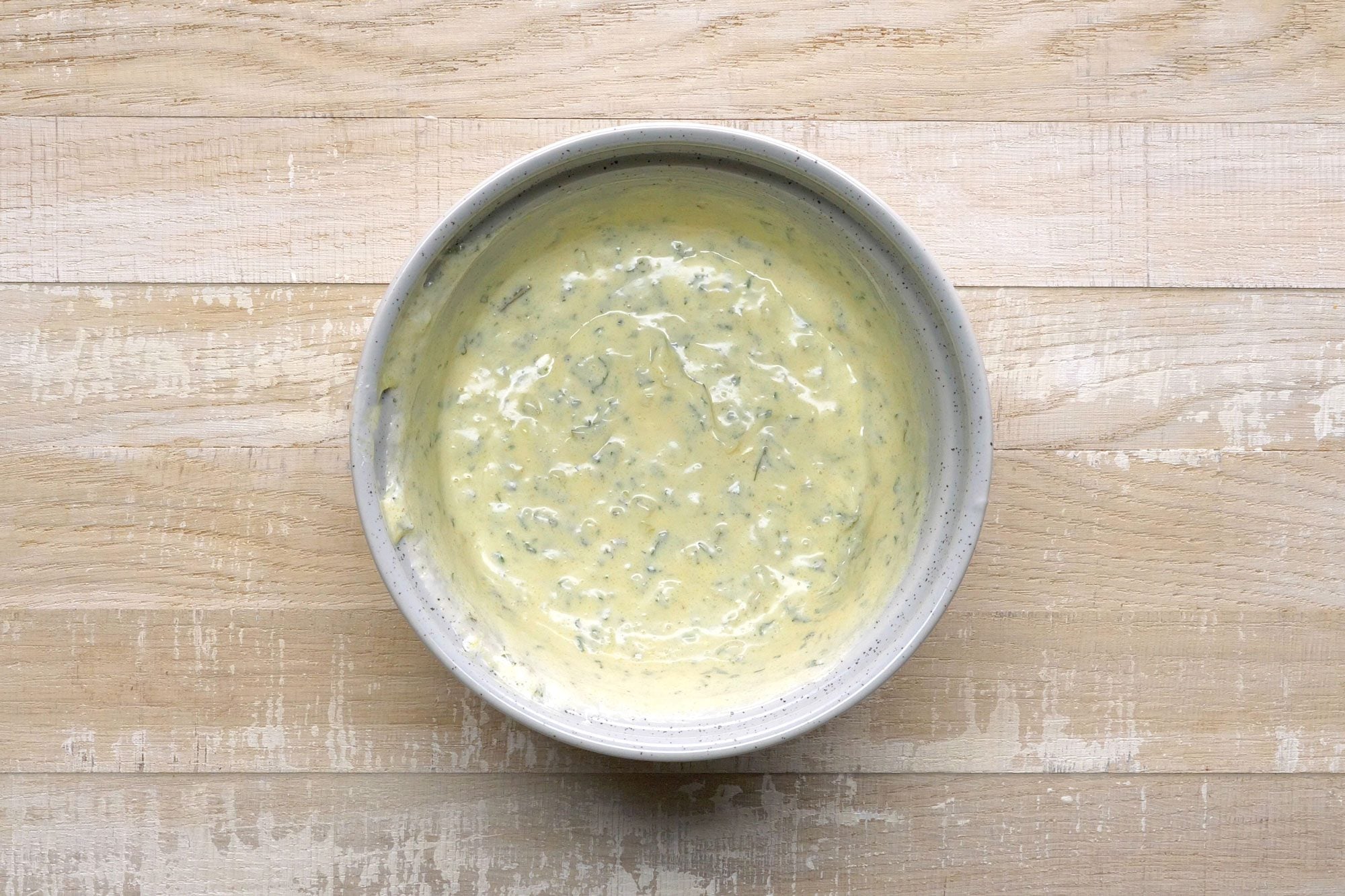 overhead shot; wooden background; Mixture for Red Potato Salad