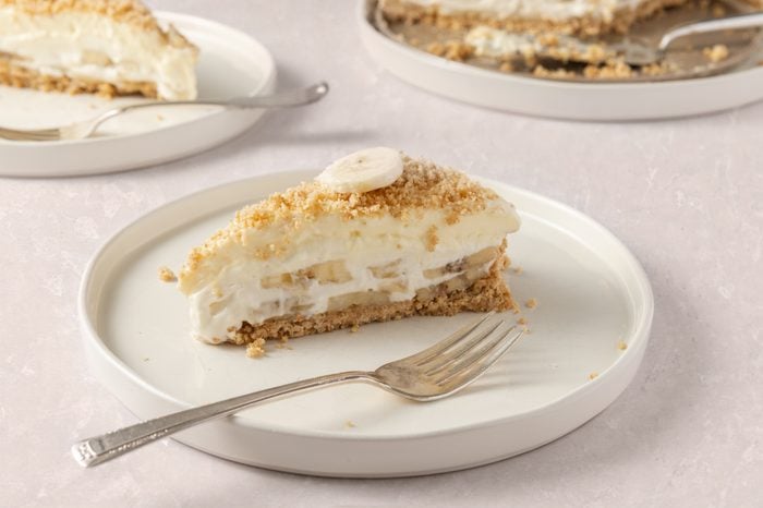 Banana cream cheesecake slices served on plates.