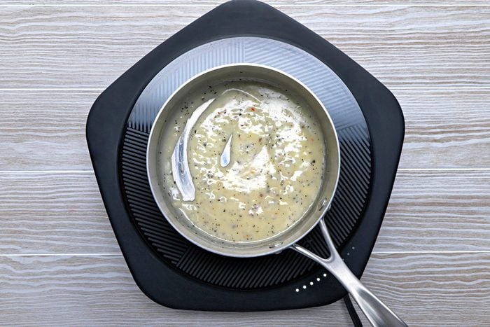 Meanwhile, in a small saucepan, melt butter. Stir in the oil, flour, garlic and seasonings until blended.