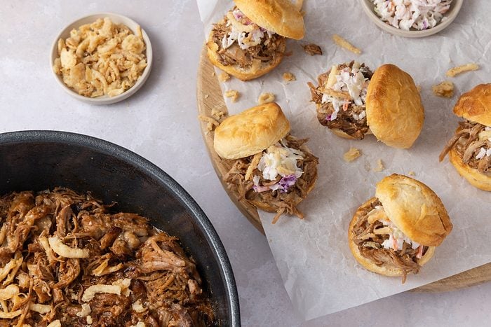 Pulled pork served on biscuits with colewslaw and french fried onions.