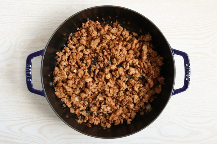 Browning sausage and onion