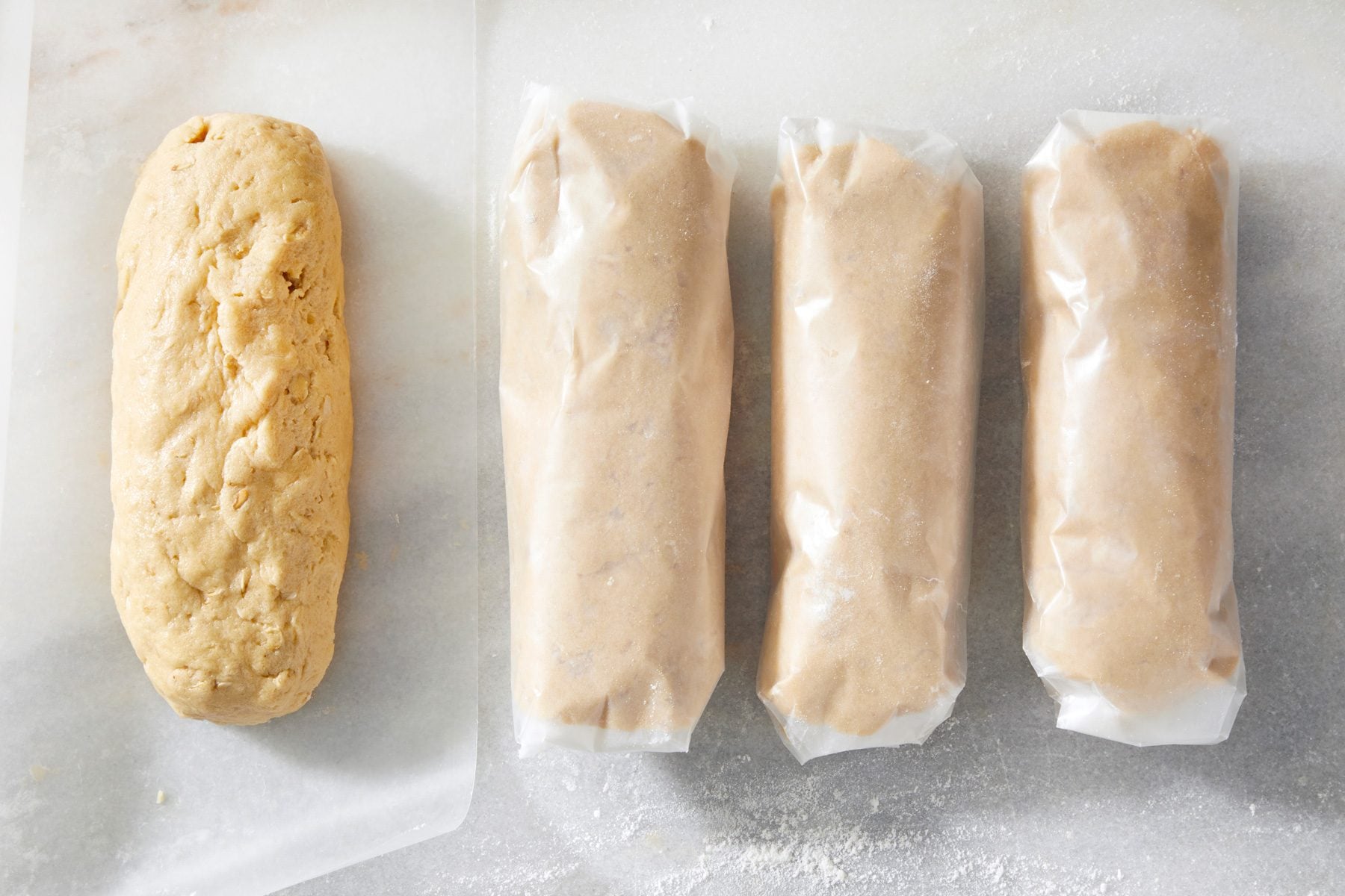 Top view shot of cookie dough rolled in baking sheet