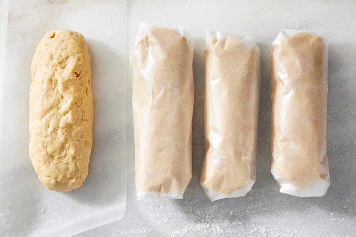 Top view shot of cookie dough rolled in baking sheet