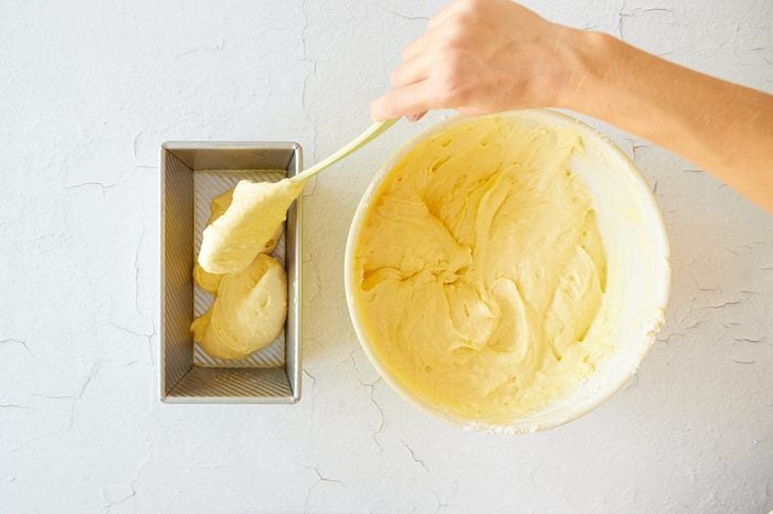 Add the whipping cream pound cake batter to the prepared pans