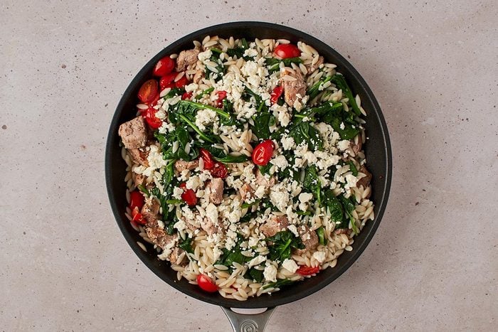 Add orzo mixture and feta
