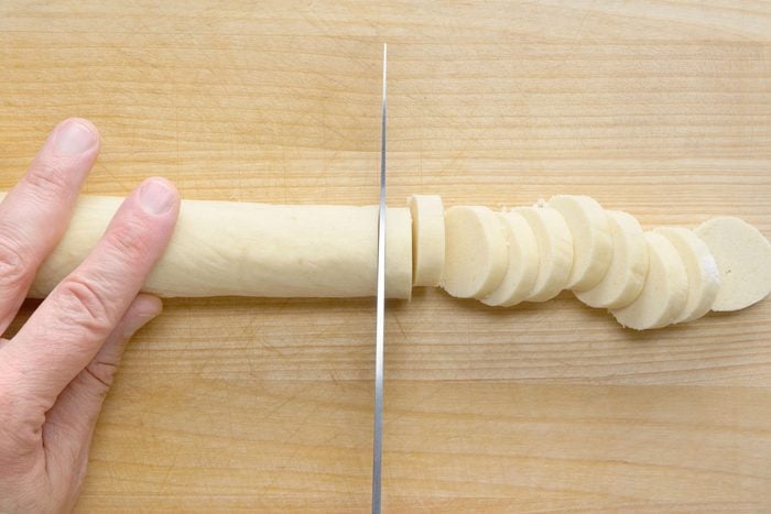 Chilled cookie dough logs sliced into 1/4-inch-thick slices