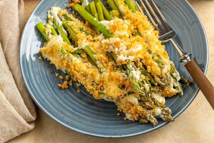 Taste of Home Asparagus Casserole photo of finished recipe served on plates.