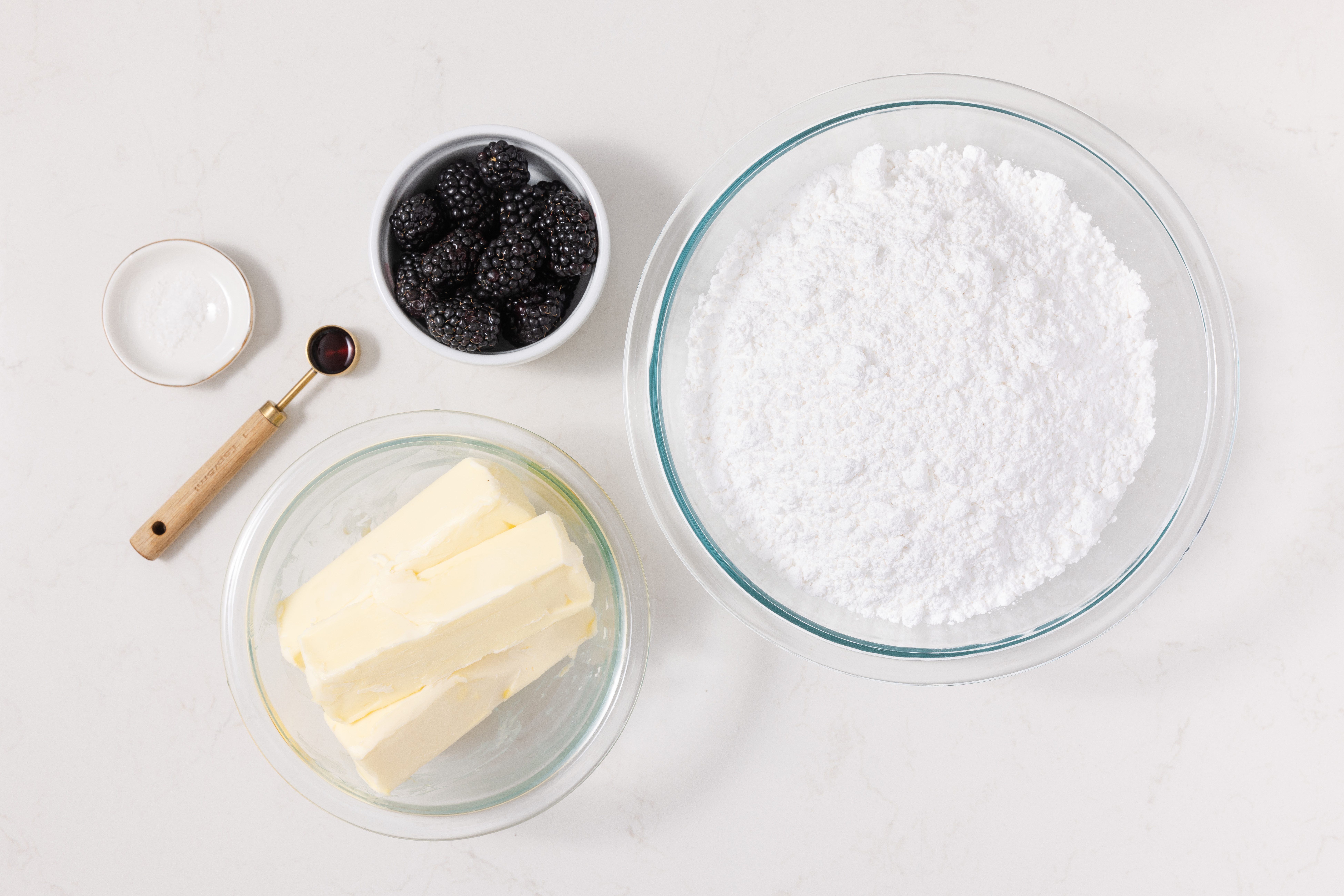 Ingredients for blackberry buttercream on kitchen counter.