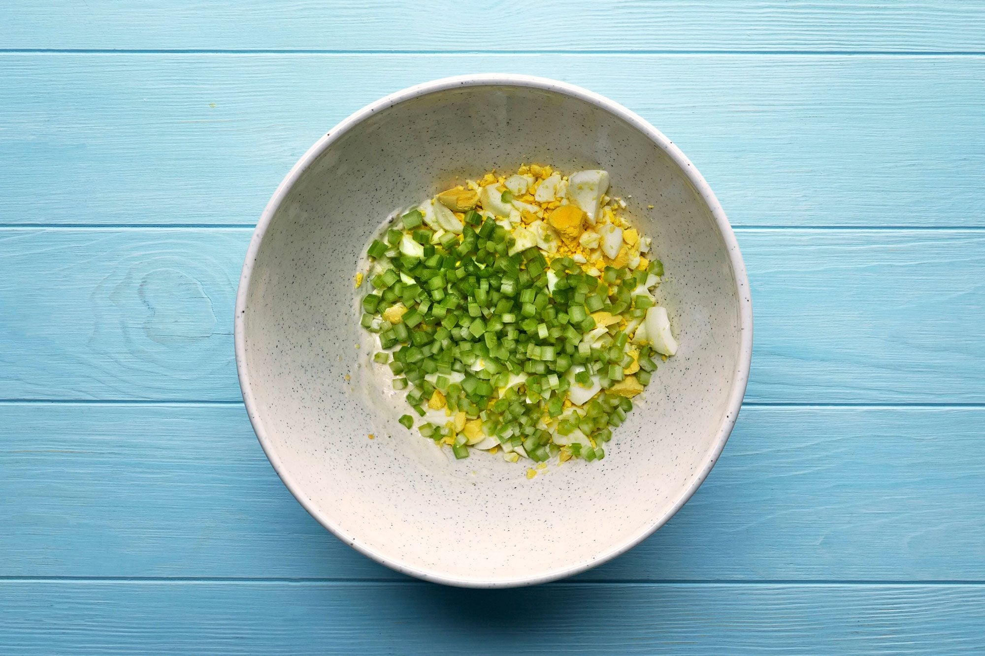 In a large bowl, combine mayonnaise, lemon juice, onion, salt and pepper. Stir in eggs and celery.