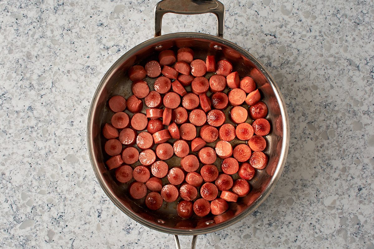Cook hot dogs
