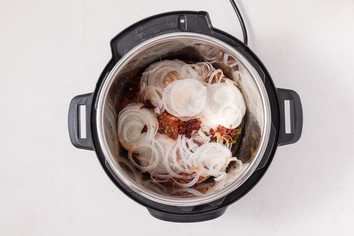 Onions, peppers and salsa added to instant-pot.