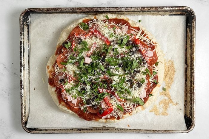 Unbaked Taste of Home Pizza Supreme on a baking sheet