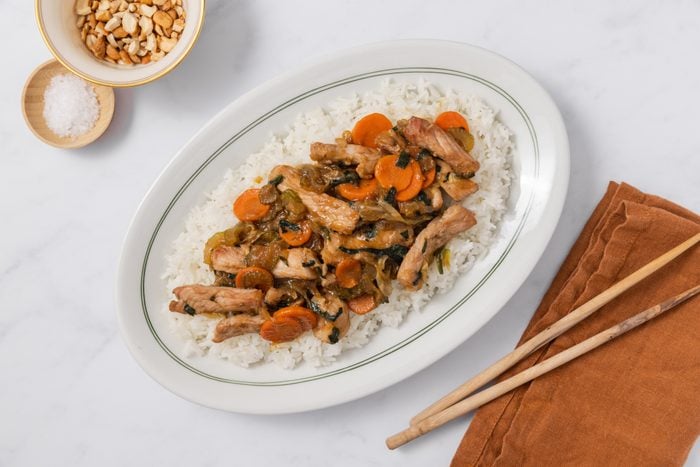 Pork chow mein served over rice.