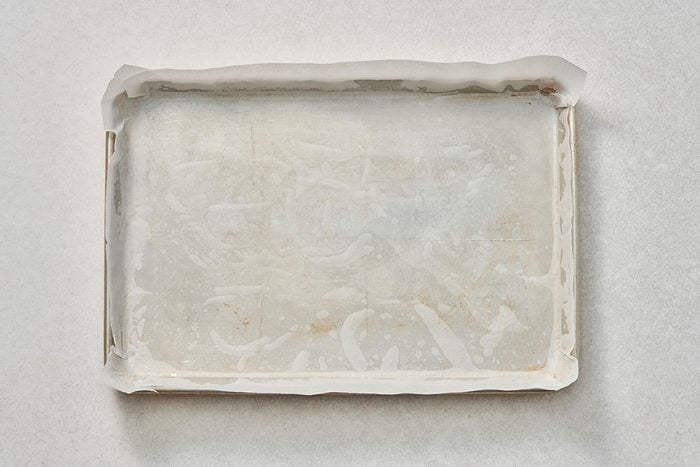 Baking pan lined with greased parchment paper