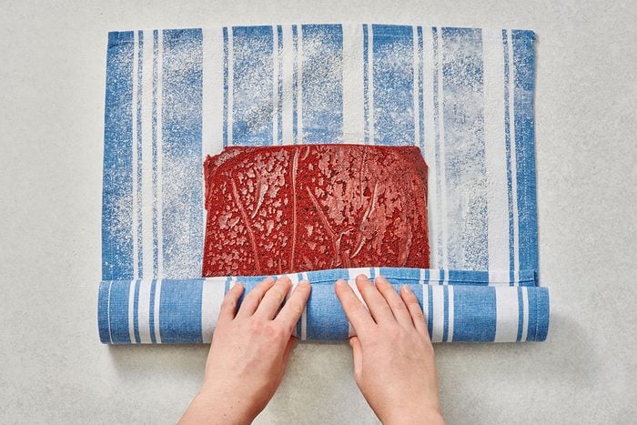 Rolling up the cake in a towel jelly-roll style