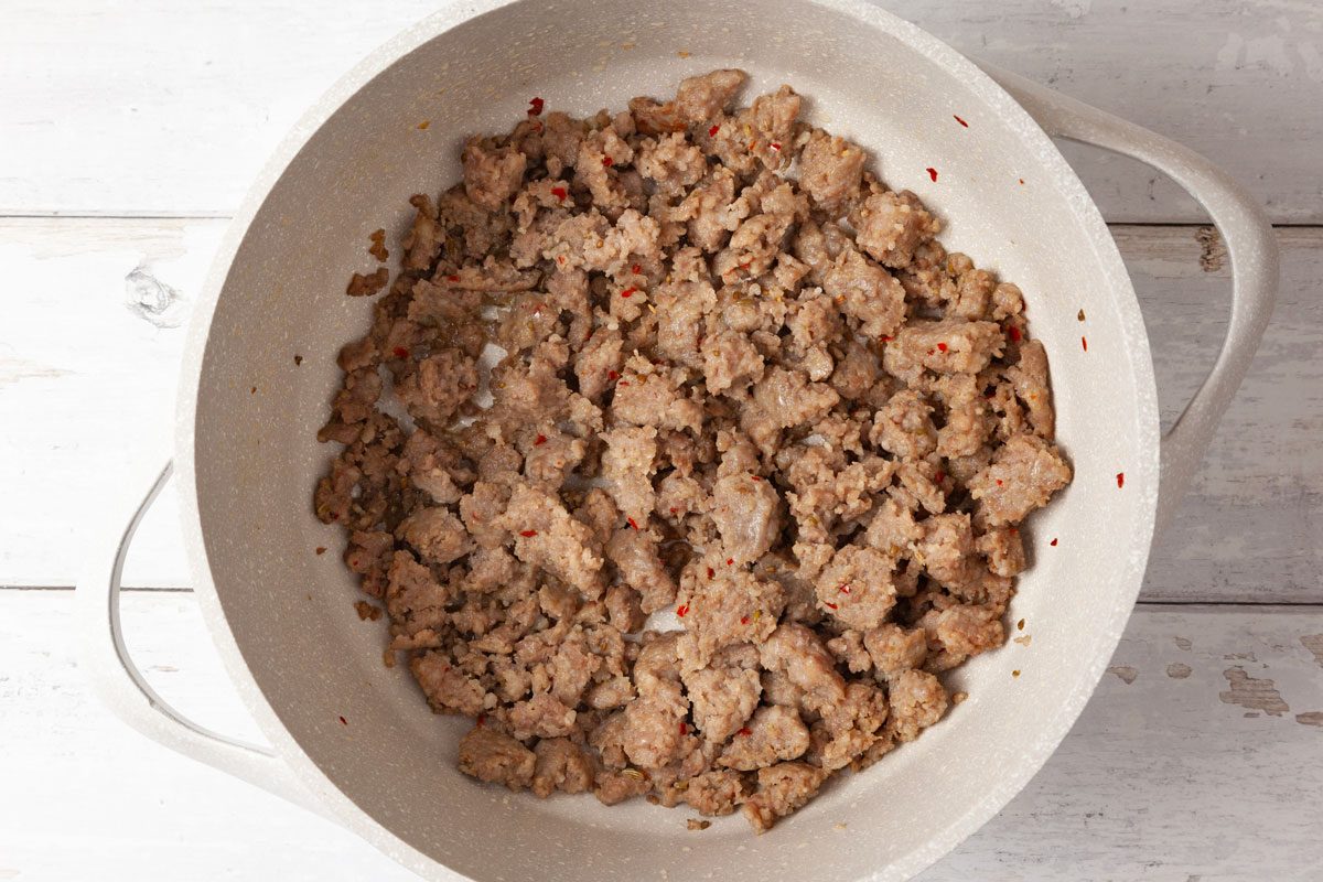 Step 2 of Taste of Home Sausage Mac and Cheese is to melt the butter over medium heat. Add the sausage and cook until it's no longer pink; for about four to five minutes, breaking it into crumbles. Drain. Remove the sausage with a slotted spoon and set aside.
