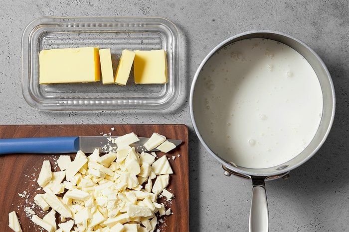 Overhead shot of all ingredients; wooden board; grey surface;
