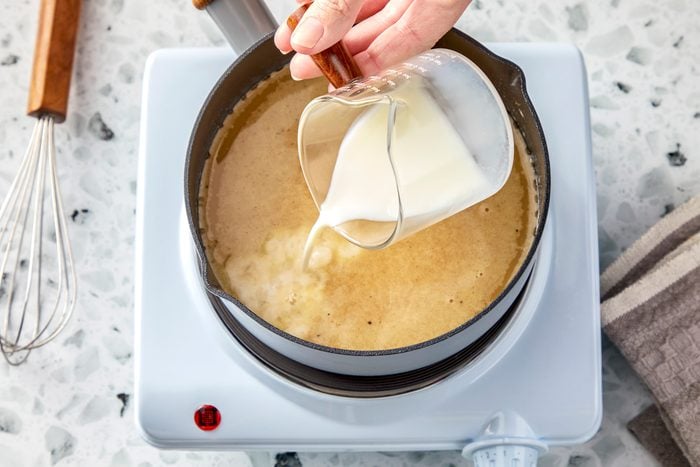Whisk in stock and milk.