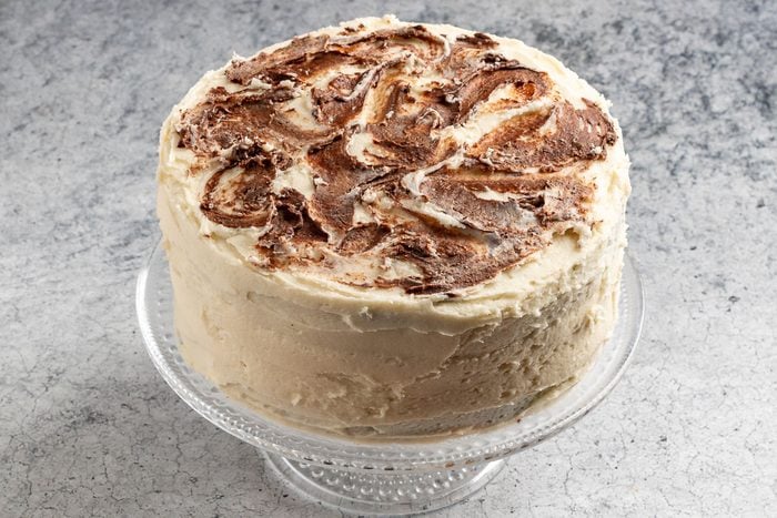 Taste of Home Marble Cake photo of adding the chocolate decoration.