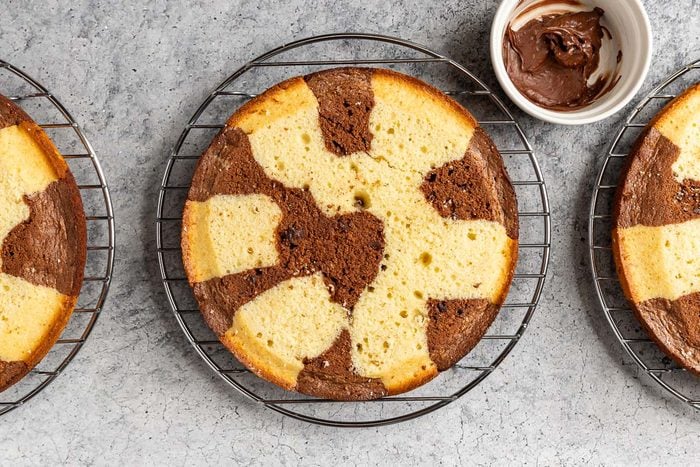 Taste of Home Marble Cake photo of evening out the cake tops and melting the chocolate chips.