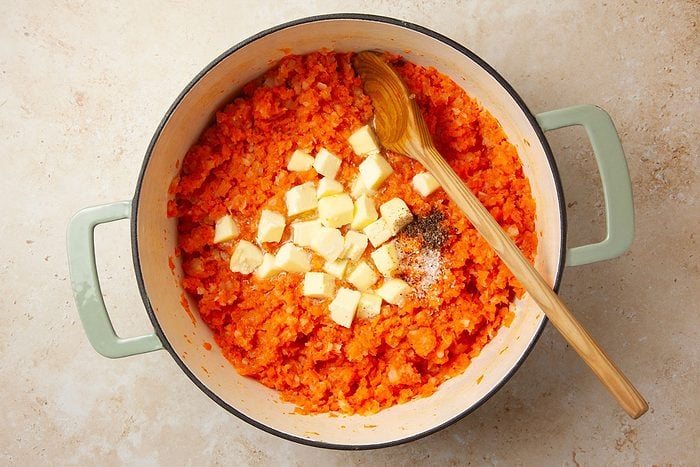 Step 2 of Taste of Home Mashed Carrots and Turnips is to mash the vegetables and add the butter and salt and pepper