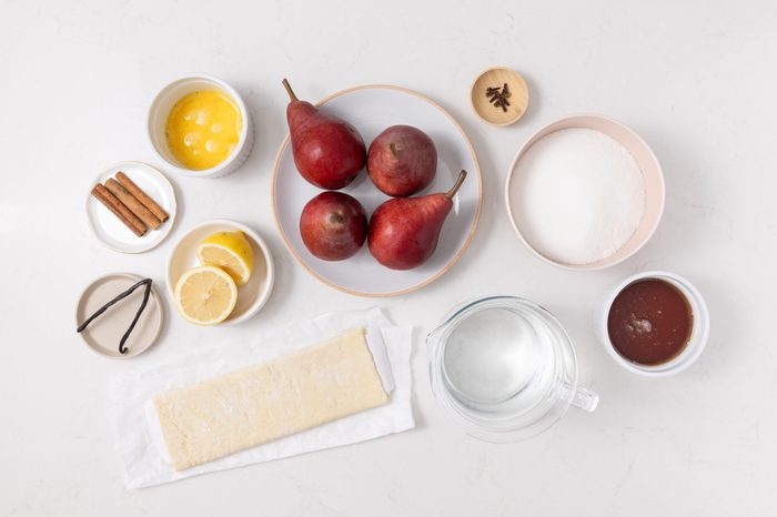 Ingredients for pear puff pastry on kitchen counter.