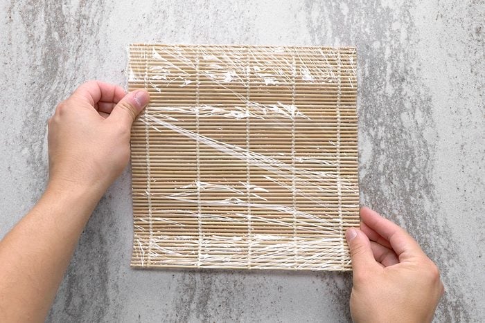 Sushi mat wrapped in plastic wrap