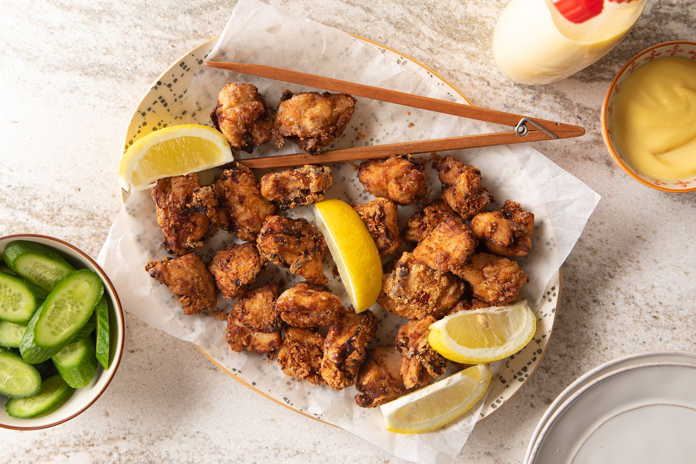 Japanese Fried Chicken (chicken Karaage) with lemon and cucumber on side