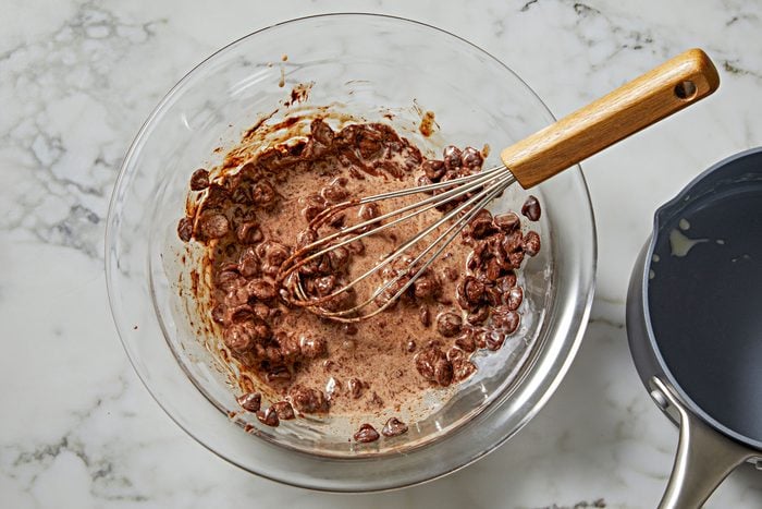 place chocolate chips in a small bowl. In a small saucepan, bring cream just to a boil.