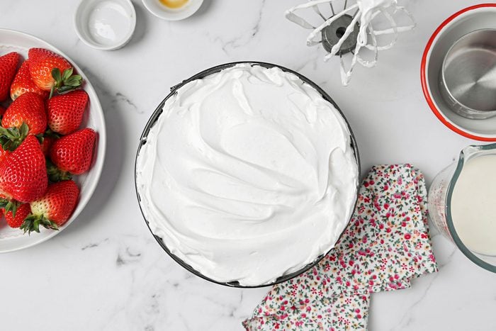 Schaum Torte batter spread into a 10 inch springform pan