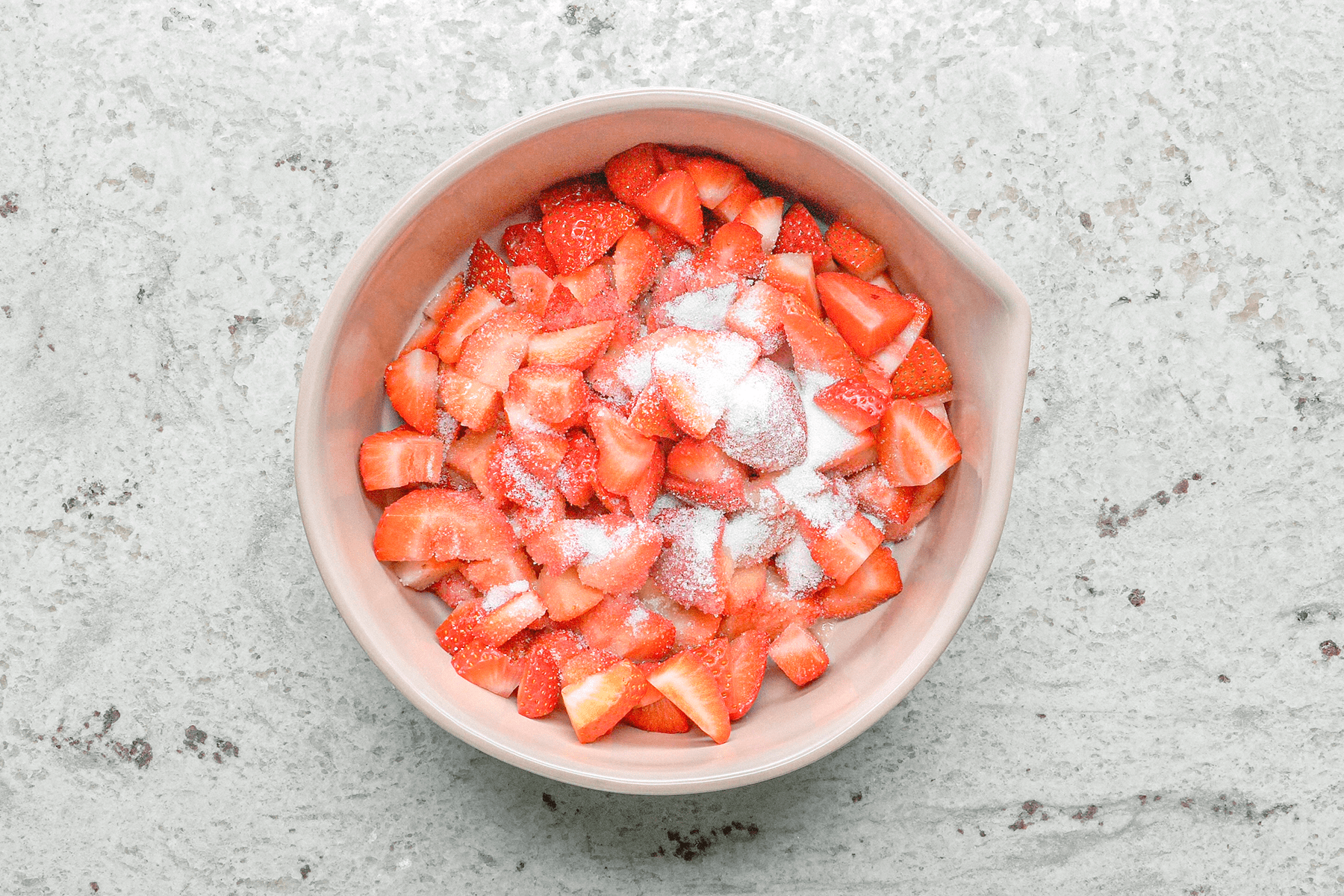 Marinating strawberries to make Strawberry Shortcake Biscuits