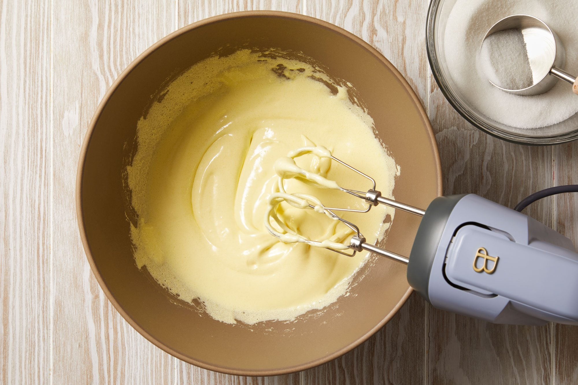 In a large bowl, beat egg yolks on high speed,
